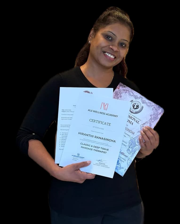 Hiranthi Ranasingha holding her massage therapist certificates